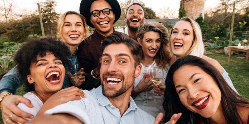 group of several adults smiling